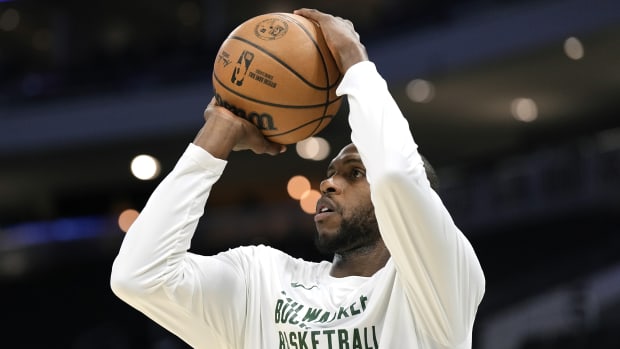  Milwaukee Bucks forward Khris Middleton (22) shoots during warmups prior to the game against the Washington Wizards